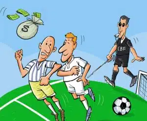 Risco na paixão nacional Na charge, dois jogadores de futebol disputam por um saco de dinheiro, enquanto isso o arbitro do jgo usa óculos e uma guia para cegos.