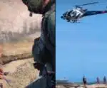Banhista é resgatado de helicóptero após cair em pedras de praia em Vila Velha