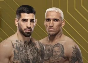 Imagem promocional da luta entre Ilia Topuria e Charles do Bronx no UFC 317. Os dois lutadores aparecem lado a lado, sem camisa, em frente a um fundo com tons dourados e cinza. O logotipo do evento UFC 317 está posicionado no canto esquerdo da imagem.
