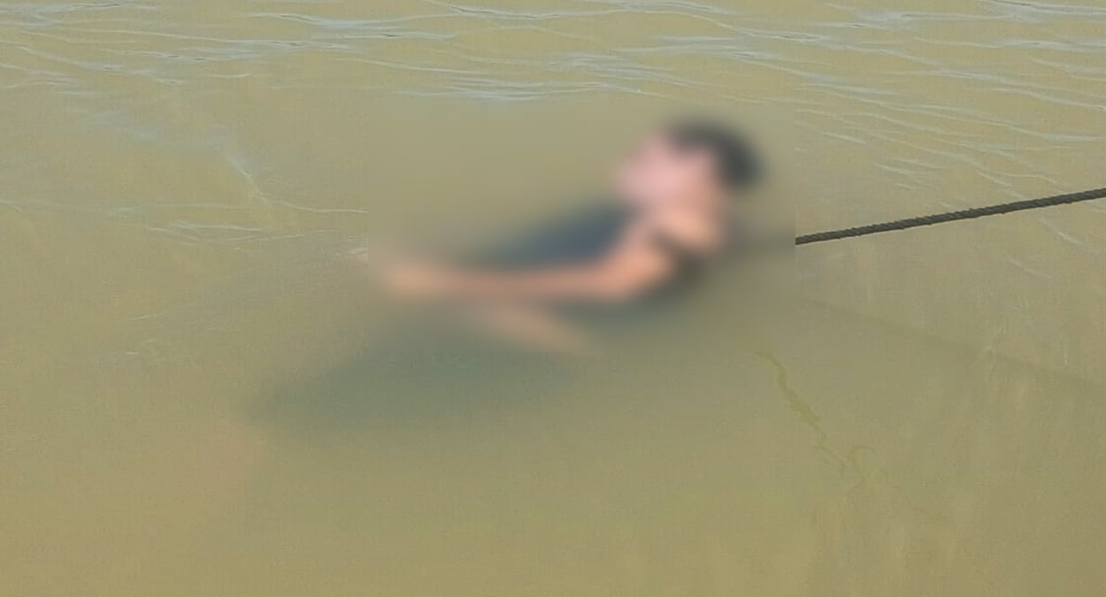 imagem mostra um homem encontrado morto dentro do rio em Marataízes - corpo encontrado em Marataízes