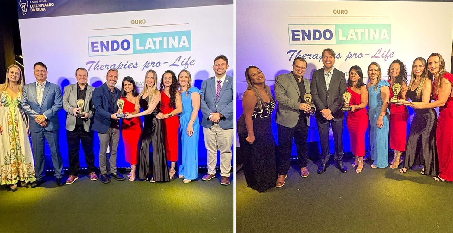Equipes recebendo troféus durante a cerimônia de premiação do Prêmio Luiz Nivaldo da Silva, com um banner ao fundo destacando 'OURO ENDO LATINA Therapies pro-Life'.