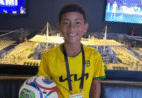 Pequeno morador de Guarapari entrou em campo com bola oficial em Brasil x Escócia